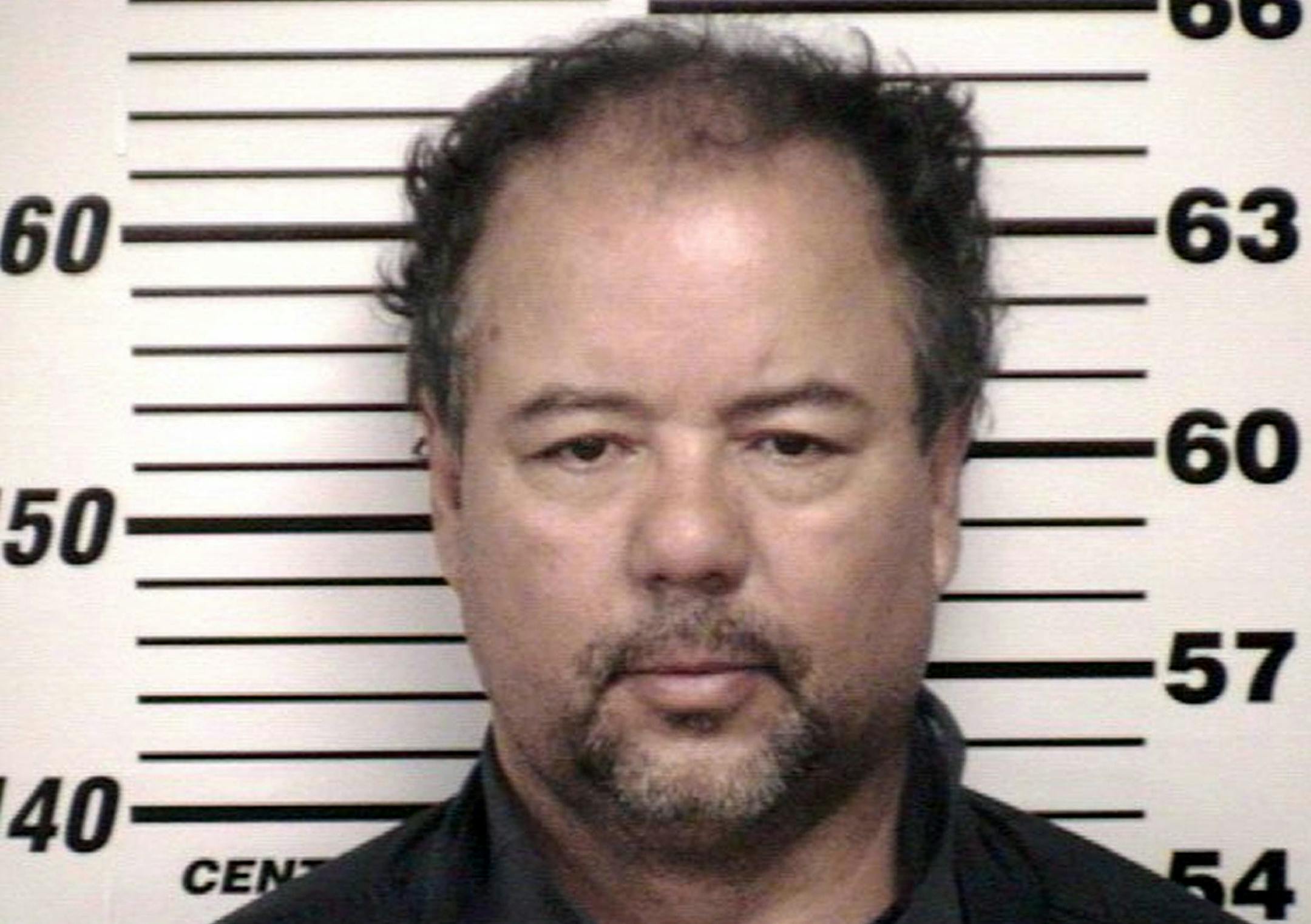 This image provided by the Cuyahoga County Sheriff's office shows the Cuyahoga County Corrections Center booking photo of Ariel Castro, 52, after he was ordered to be held on $8 million bail Thursday, May 9, 2013, in Cleveland. Castro, a former school bus driver, is accused of imprisoning three young women and beating them repeatedly over a decade in Cleveland. (AP Photo/Cuyahoga County)