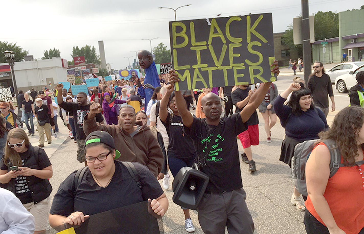 Black Lives Matter St Paul Marcher start walking towards the fair grounds from Hamline Park. ] JIM GEHRZ &#xef; james.gehrz@startribune.com<mailto:james.gehrz@startribune.com> / Falcon Heights, MN / August 29, 2015<x-apple-data-detectors://1> / 11:00 AM<x-apple-data-detectors://2> &#xf1; BACKGROUND INFORMATION: Black Lives Matter St Paul vows to disrupt State Fair's first Saturday by assembling at Hamline Park and marching to the fairgrounds entrance. ORG XMIT: MIN1508291208260130