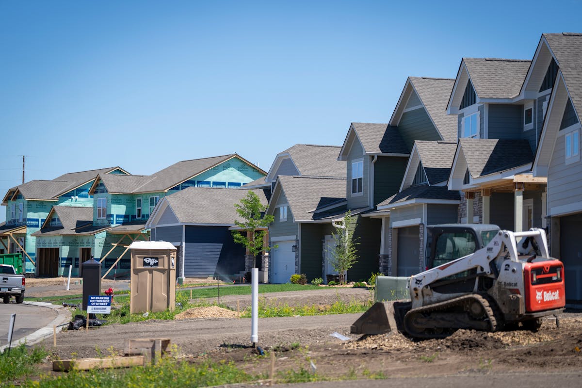 Large-scale homes (3000 square feet plus) were under construction alongside completed homes in the Brookshire development in Lakeville on Thursday. La
