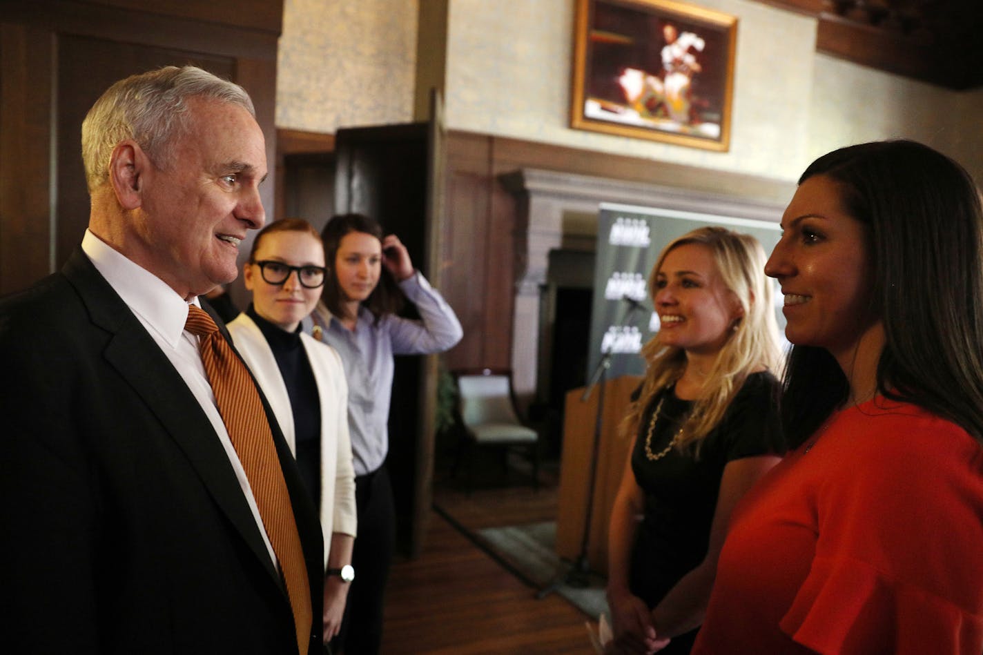 Gov. Mark Dayton spoke with league founder and commissioner Dani Rylan, center, and deputy commissioner Hayley Moore prior to the announcement. ] ANTHONY SOUFFLE &#xef; anthony.souffle@startribune.com Officials with the National Women's Hockey League held a press conference to announce they had acquired the Minnesota Whitecaps Tuesday, May 15, 2018 at Herbie's on the Park in St. Paul, Minn.