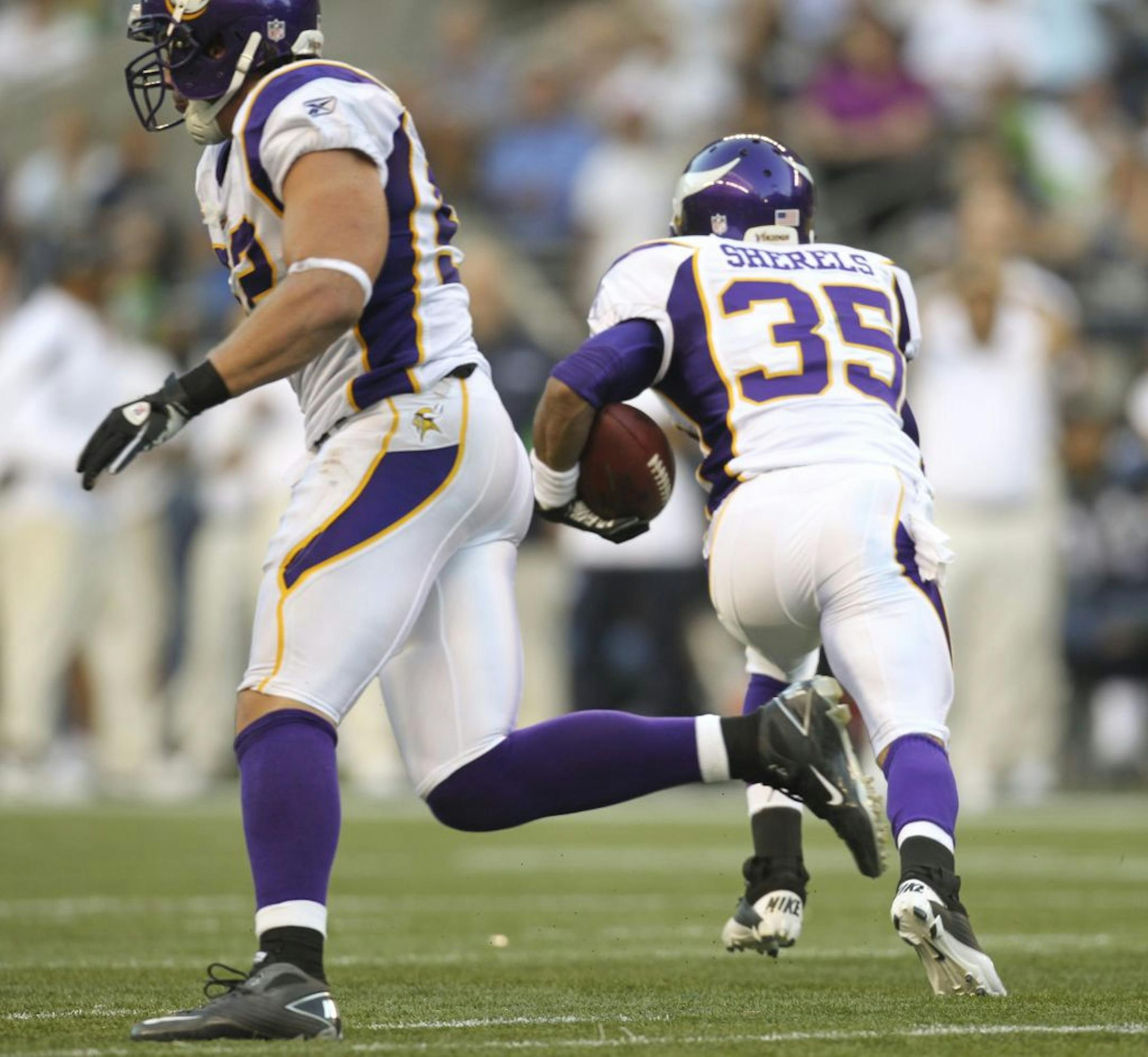 The Vikings' Marcus Sherels intercepted a Seattle pass and returned it for a touchdown in the first quarter Saturday night.