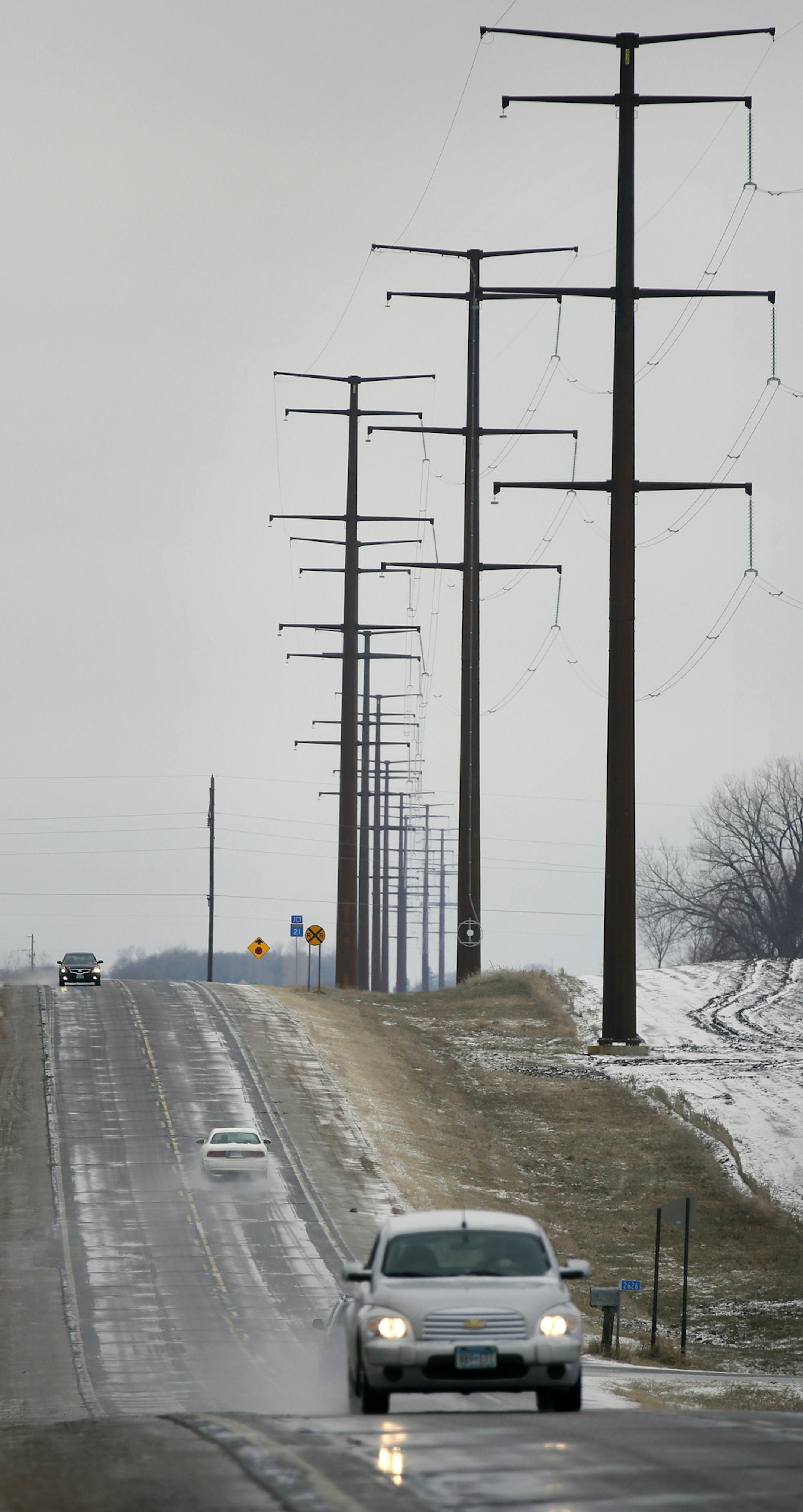 One year after he thought he triumphed with overwhelming bipartisan support in the Minnesota Legislature, Dave and Florence Minar, owners of one of the state's top organic farms, finds themselves in court next week, fighting still to exert their rights over the powerline company that has run its massive lines across their land. Here, Power Lines run along side the road near Cedar Summit Farm. ] BRIAN PETERSON &#x2022; brian.peterson@startribune.com New Prague, MN 4/17/2014