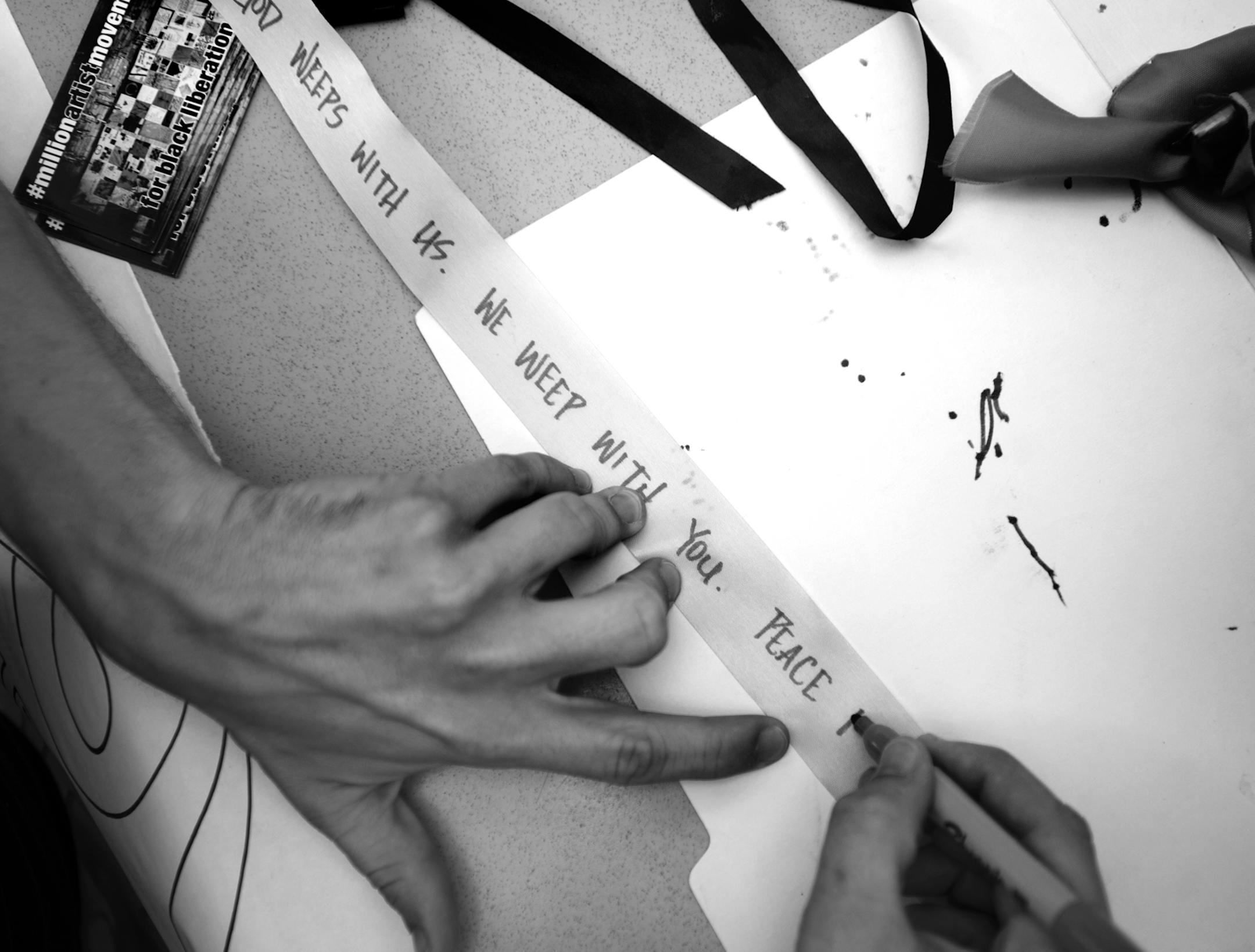 Ian McConnell wrote a message of hope on a ribbon that will be delivered to Emanuel African Methodist Episcopal Church in Charleston, S.C. ] Aaron Lavinsky ï aaron.lavinsky@startribune.com A vigil was held for the nine victims killed in a mass shooting at a historic church in Charleston, S.C., Thursday night at the Sumner Library in Minneapolis. It followed a procession which began nearby at the Phyllis Wheatley Community Center. ORG XMIT: MIN1506181851381568