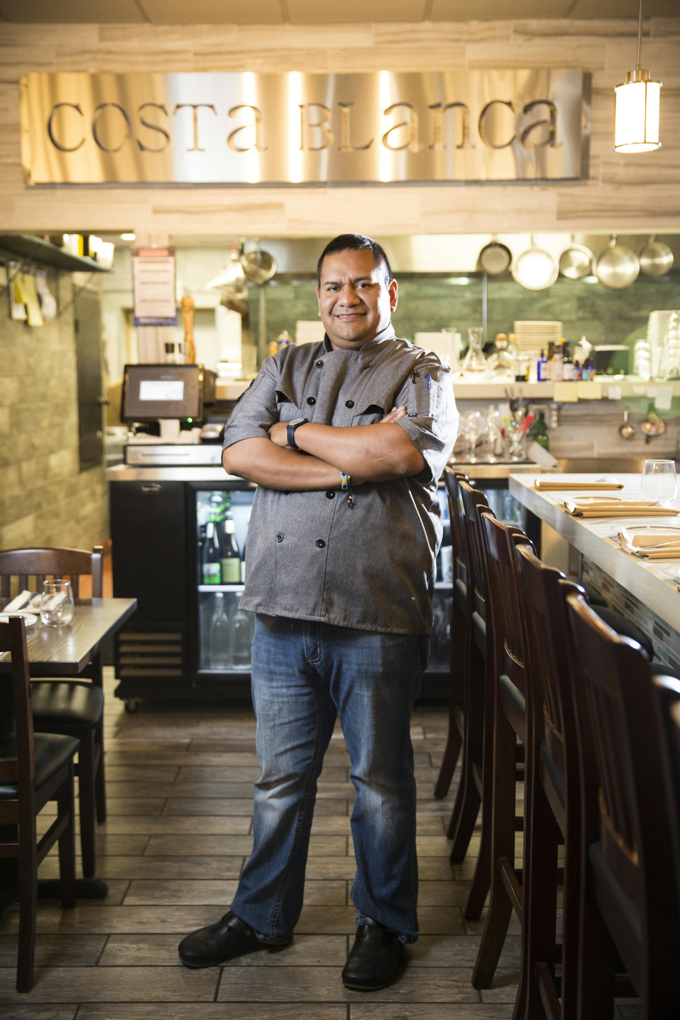 Chef Hector Ruiz poses at his restaurant Costa Blanca Bistro.