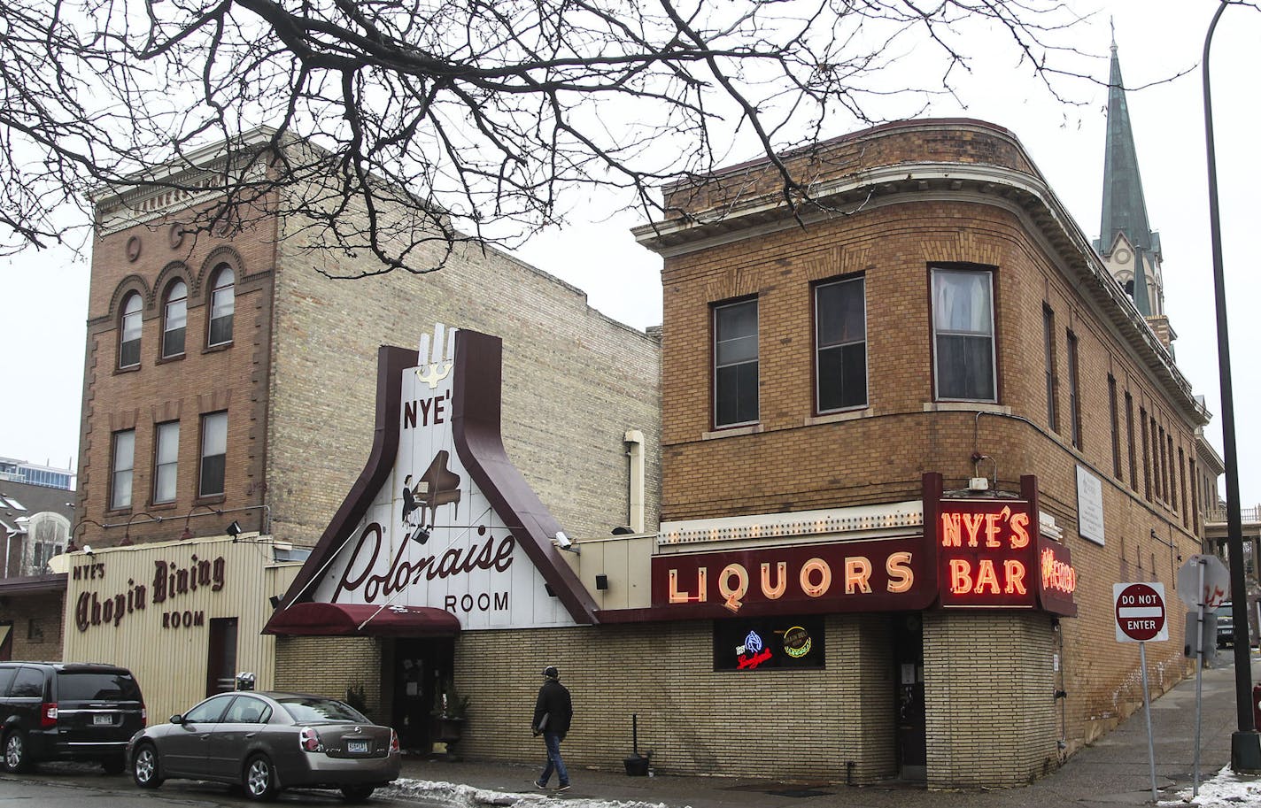 A three-story building to the left of the iconic Nye's Polonaise front door was built as a harness shop in 1905 was seen Friday, DEc. 5, 2014, in Minneapolis, MN.](DAVID JOLES/STARTRIBUNE)djoles@startribune.com The owner of Nye's Polonaise may intend to close the Minneapolis institution next year, but demolishing the buildings wil be a tough sell at City Hall. Two of the four buildings on the site are contributing to the St. Anthony Falls Historic District, which gives them major protections und