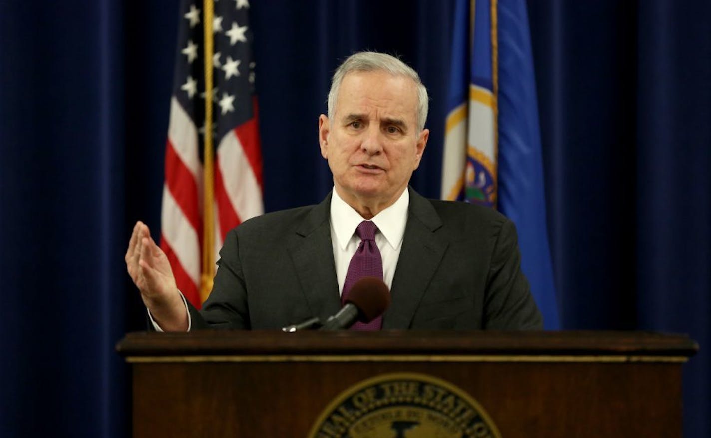 Gov. Mark Dayton said Monday that video footage from an ambulance at the scene where an unarmed black man was fatally shot by police appeared to be inconclusive.