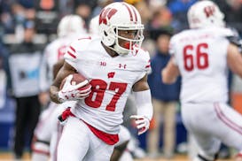 Wisconsin wide receiver Quintez Cephus (87) runs with the ball during an NCAA college football game against Illinois Saturday, Oct. 28, 2017 at Memori