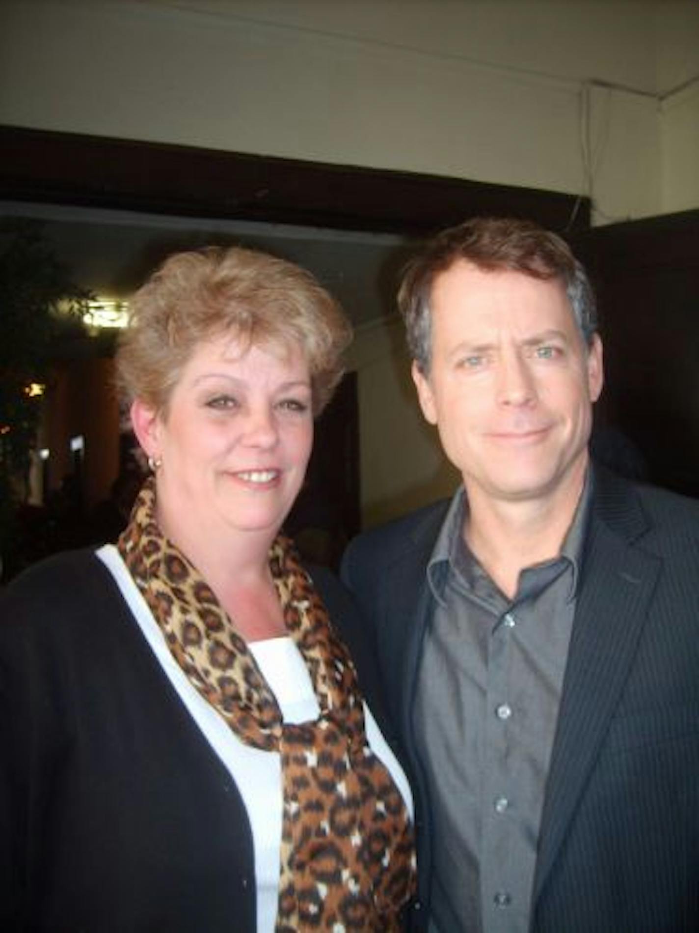 1cj0307 Photo provided by Debbie and Bob Black.
Debbie Black with Greg Kinnear, who shot scenes for "The Convincer" at Minneapolis' Dahl Violin Shop, which is owned by her husband Bob Black