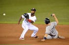 New York Yankees first baseman Mark Teixeira (25) slides in safely off a steal at second as Minnesota Twins shortstop Danny Santana (39) was unable to