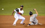 New York Yankees first baseman Mark Teixeira (25) slides in safely off a steal at second as Minnesota Twins shortstop Danny Santana (39) was unable to
