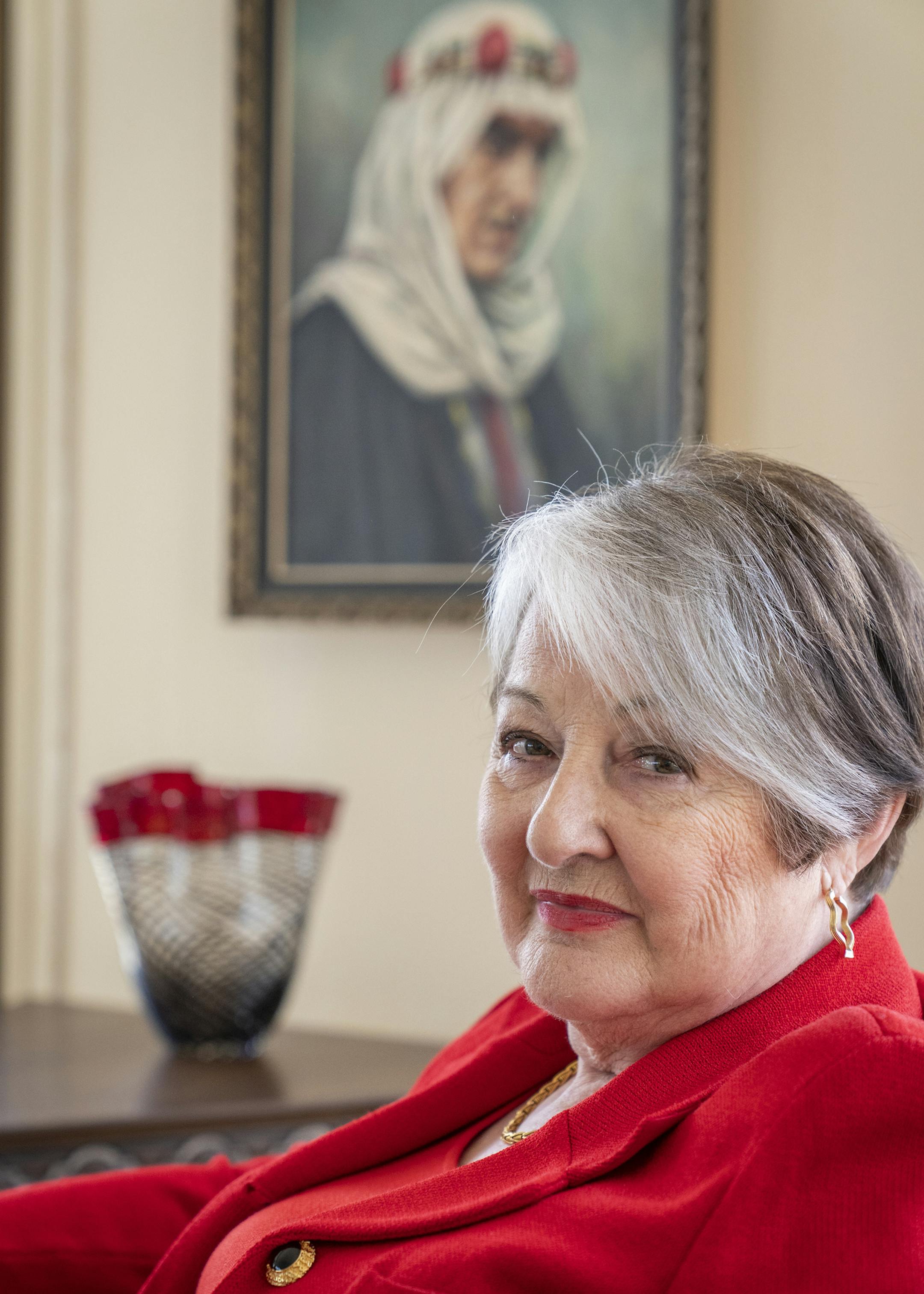 Helene Houle poses for a portrait with a painting of her late husband John Nasseff inside her renovated condo. ] LEILA NAVIDI ¥ leila.navidi@startribune.com BACKGROUND INFORMATION: Helene Houle poses for a portrait with a painting of her late husband John Nasseff inside her renovated condo in downtown St. Paul on Friday, May 3, 2019. The condo was renovated by interior designer Jim Noble.