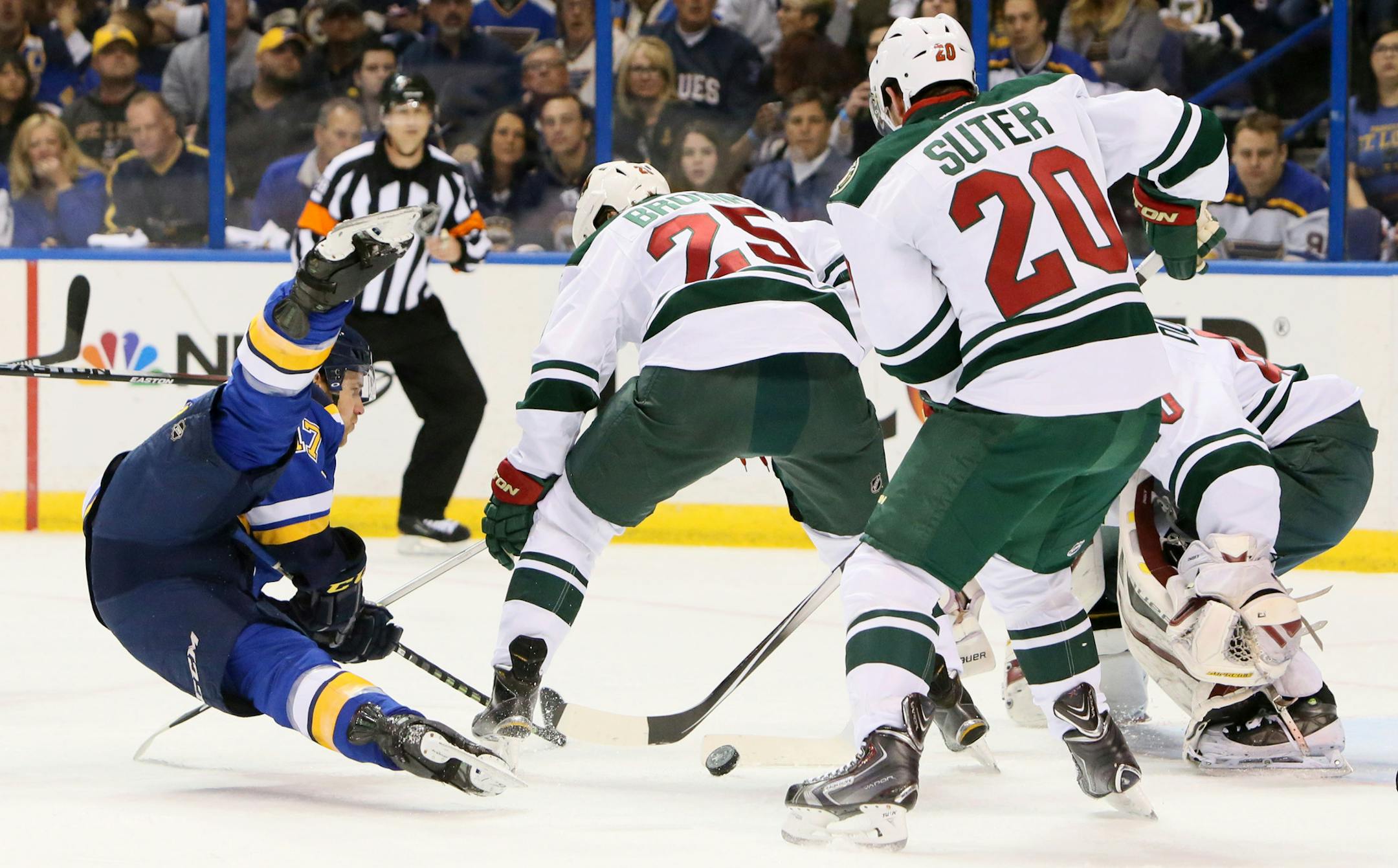 St. Louis Blues left wing Jaden Schwartz, left, is knocked off his skates by Minnesota Wild defenseman Ryan Suter in first-period action in Game 5 of an NHL hockey first-round playoff series on Friday, April 24, 2015, in St. Louis. (Chris Lee/St. Louis Post-Dispatch via AP) EDWARDSVILLE INTELLIGENCER OUT; THE ALTON TELEGRAPH OUT; MANDATORY CREDIT