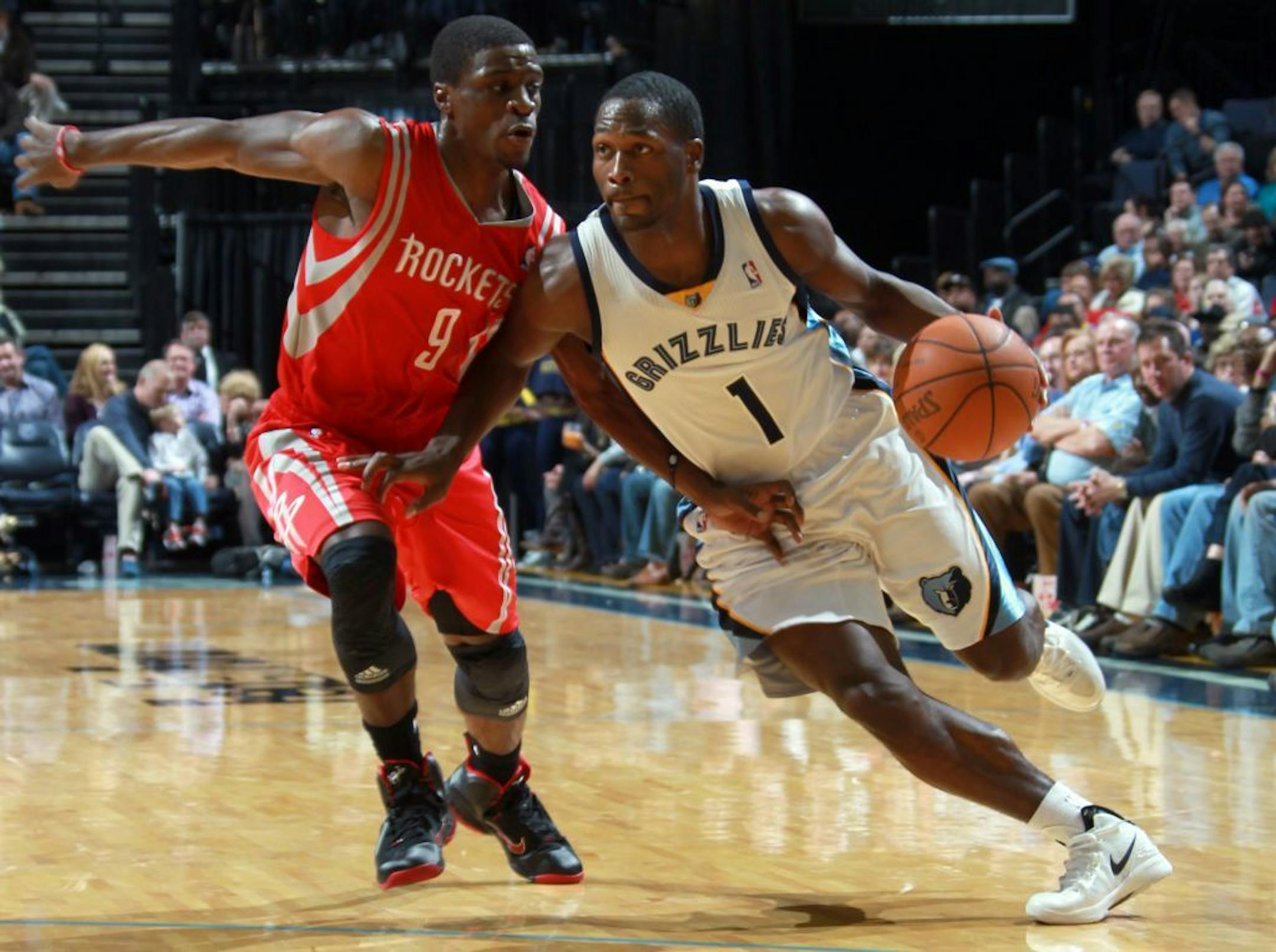 Memphis Grizzlies forward Jeremy Pargo (1) drives against the defense of Houston Rockets guard Jonny Flynn (9) in the second half of an NBA basketball game on Friday, Dec. 30, 2011, in Memphis, Tenn. The Grizzlies defeated the Rockets 113-93.