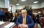 Former President Donald Trump, joined by his attorney Susan Necheles, left, sits at the defense table in Manhattan criminal court, Tuesday, May 7, 202