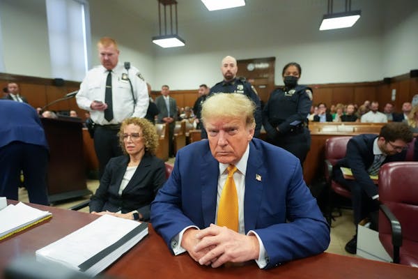 Former President Donald Trump, joined by his attorney Susan Necheles, left, sits at the defense table in Manhattan criminal court Tuesday in New York.