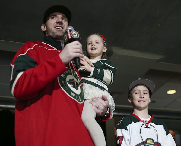 Former Wild goalie Josh Harding announced "Let's Play Hockey!" before Tuesday night's game against the Sharks. He was assisted by his daughter, Paisle