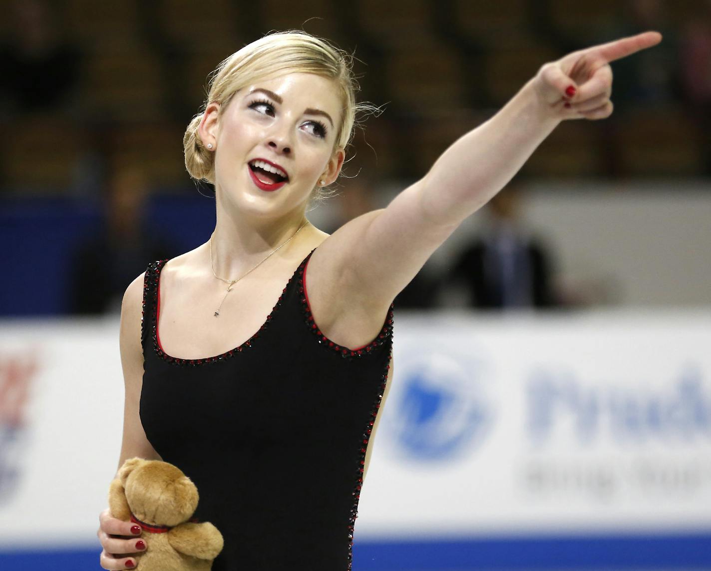 Gracie Gold points to the crowd after she performed in the ladies short program at the Skate America figure skating competition Friday, Oct. 23, 2015, in Milwaukee. (AP Photo/Jeffrey Phelps) ORG XMIT: WIJP154