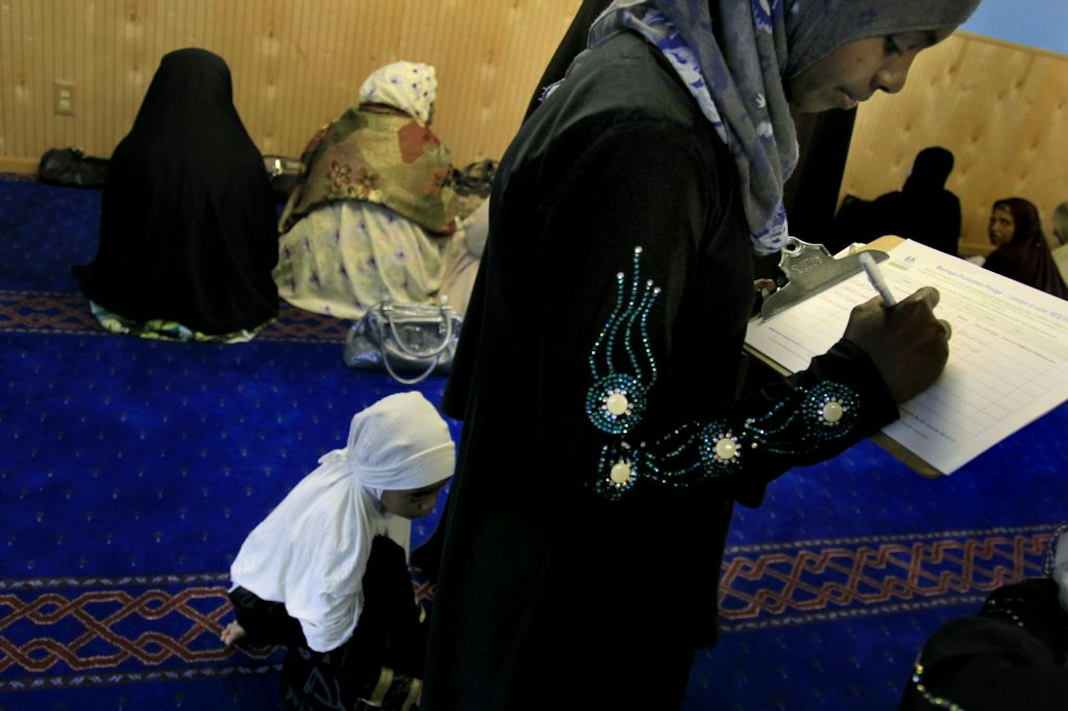 Mariama Sameru signed a petition for Winnie Okafor, a coordinator with Minnesota for Marriage, which backs the amendment. Okafor made a presentation to Muslim women before prayer at the Tawfiq Islamic Center in north Minneapolis.