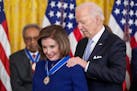 President Joe Biden awards the nation's highest civilian honor, the Presidential Medal of Freedom, to Rep. Nancy Pelosi, D-Calif., during a ceremony i