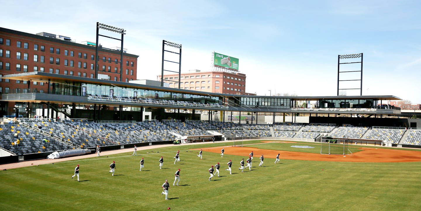 Hamline warmed up in the new stadium before the game. Feature on St. Paul baseball history leading up to the opening of a new CHS Field, Hamline played Macalester Wednesday April 15 2015 in St. Paul Minnesota. ] Jerry Holt/ Jerry.Holt@Startribune.com ORG XMIT: MIN1504161204452395