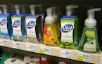 Soaps containing the antibacterial chemical triclosan are displayed on a shelf at a Minneapolis pharmacy. Gov. Mark Dayton on Friday signed a bill to 