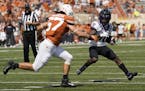 TCU wide receiver JD Spielman (10) runs around Texas linebacker Cort Jaquess (57) during the first half of an NCAA college football game, Saturday, Oc