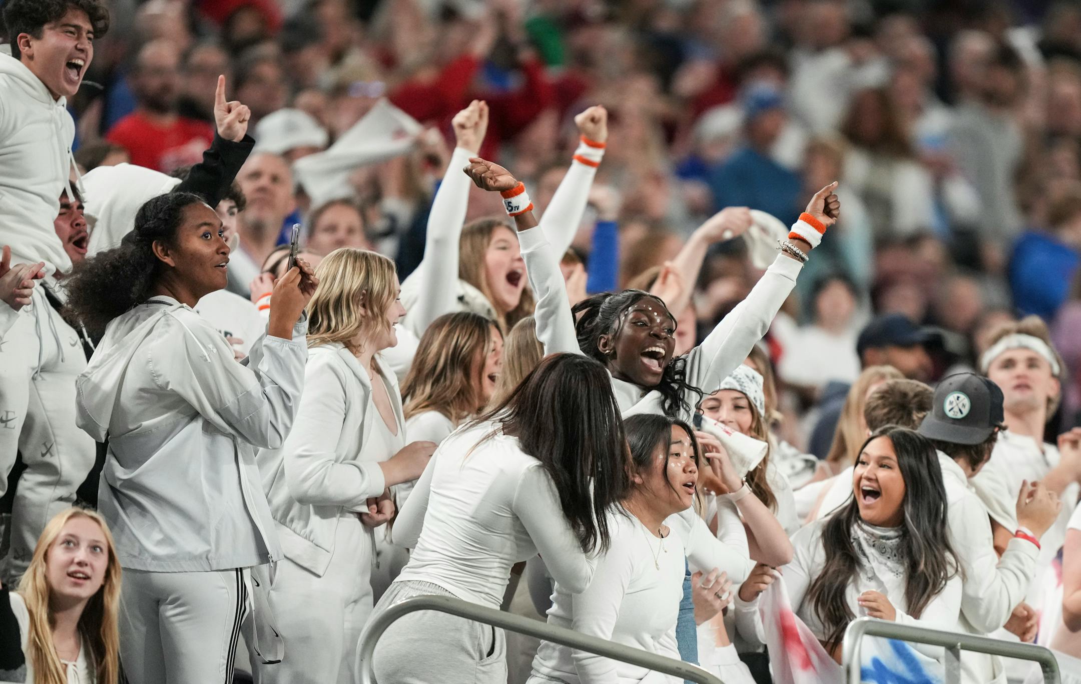 Simley Spartans fans cheer in the stands in the second half.