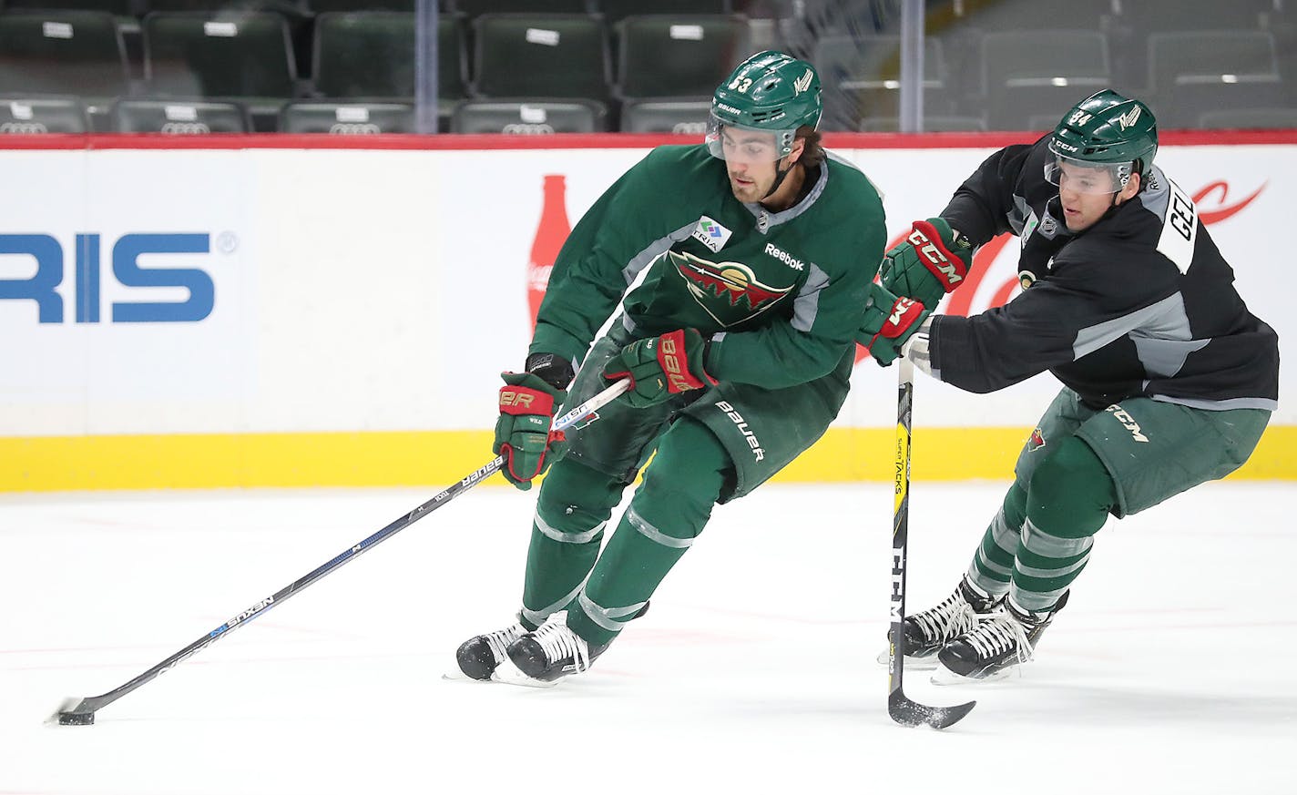 Minnesota Wild Alex Tuch, left, and defenseman Guillaume Gelinas battled for the puck during the first day of practice on the ice at the Xcel Energy Center, Friday, September 23, 2016 in St. Paul, MN. ] (ELIZABETH FLORES/STAR TRIBUNE) ELIZABETH FLORES &#x2022; eflores@startribune.com ORG XMIT: MIN1609231220040037