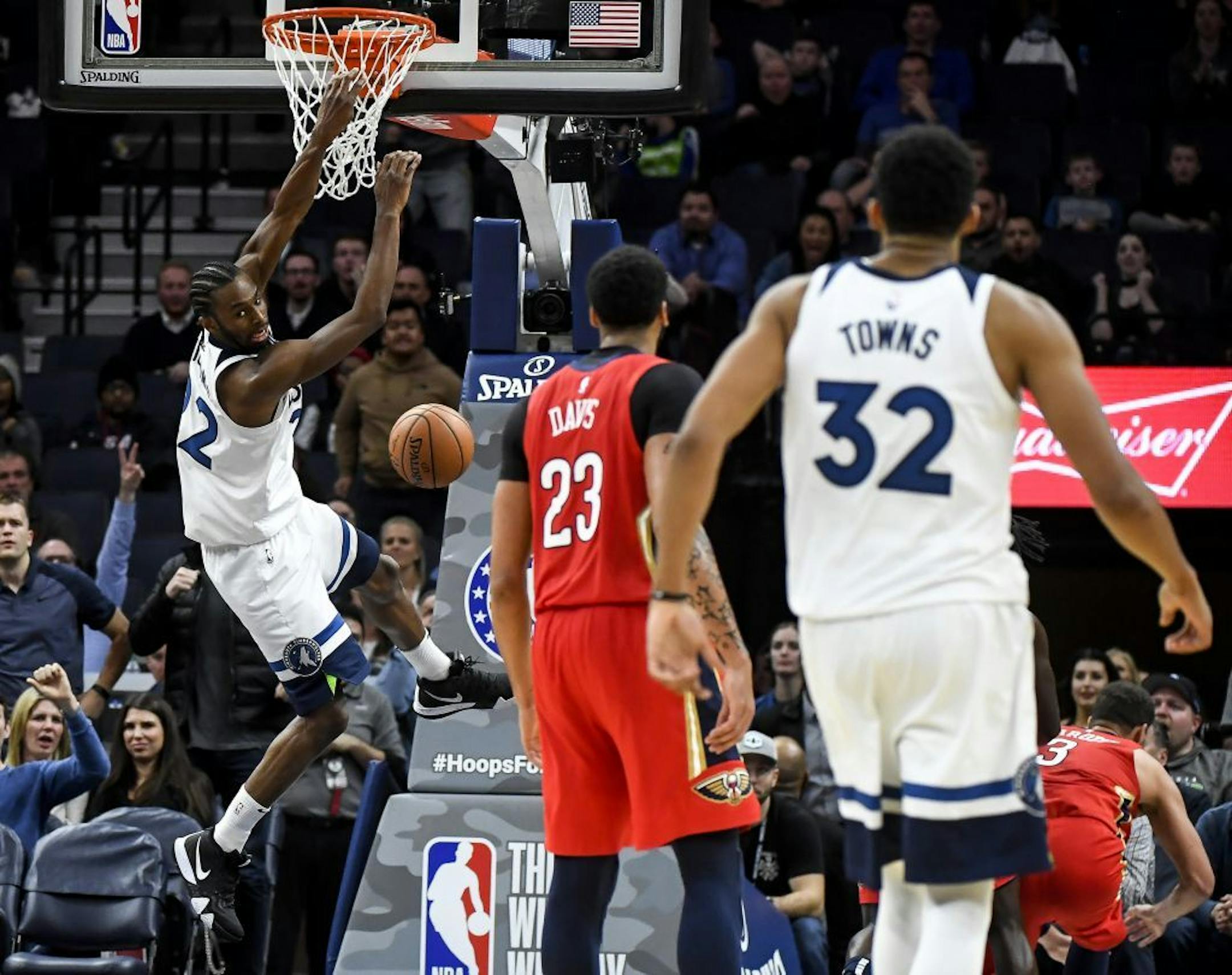 Andrew Wiggins (22) follows through with a monster dunk after being fouled on the way to the basket late in the fourth quarter.