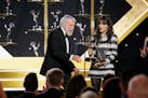Zooey Deschanel, right, presents the award for outstanding guest performance in a daytime drama series to Dick Van Dyke for "Days of our Lives" during