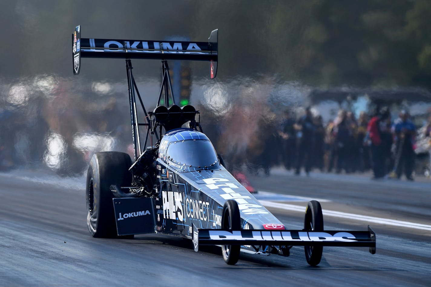 In this photo provided by the NHRA, Top Fuel points leader Justin Ashley claims his second No. 1 qualifier of the season in his dragster on Saturday, Aug. 19, 2023, at the Lucas Oil NHRA Nationals in Brainerd, Minn. (Marc Gewertz/NHRA via AP)