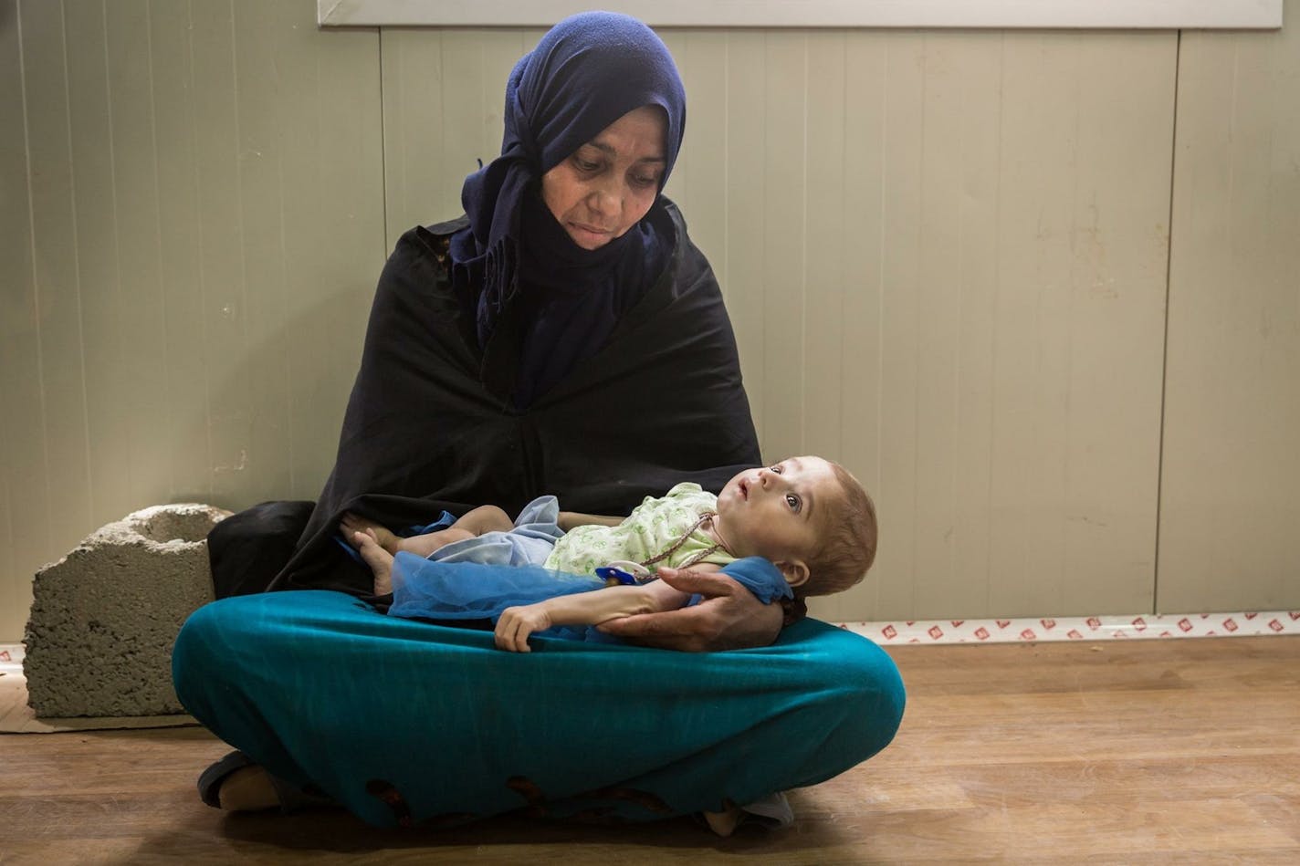 A woman and child treated by AdventistHelp at a refugee camp on the border of Greece and Macedonia in 2016.