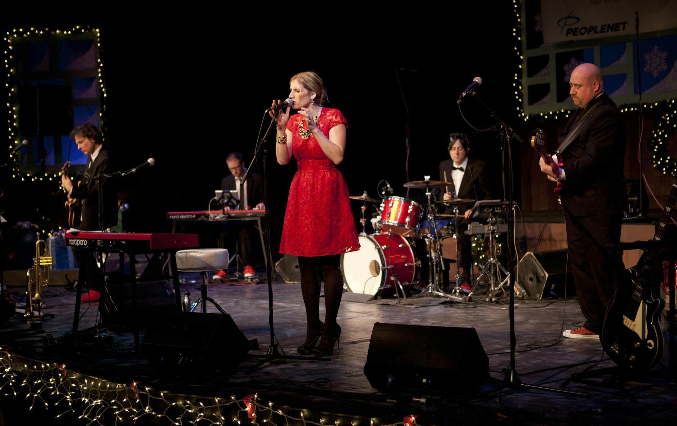 Photo by by Jodi O'Shaughnessy Olson Alison Scott performs her Christmas show at Mayo Civic Theater Dec. 5, 2013. Kevin Bowe on guitar, Charlie Peterson on keys, Peter Anderson on drums, Justin Rieken on bass, and Scott.