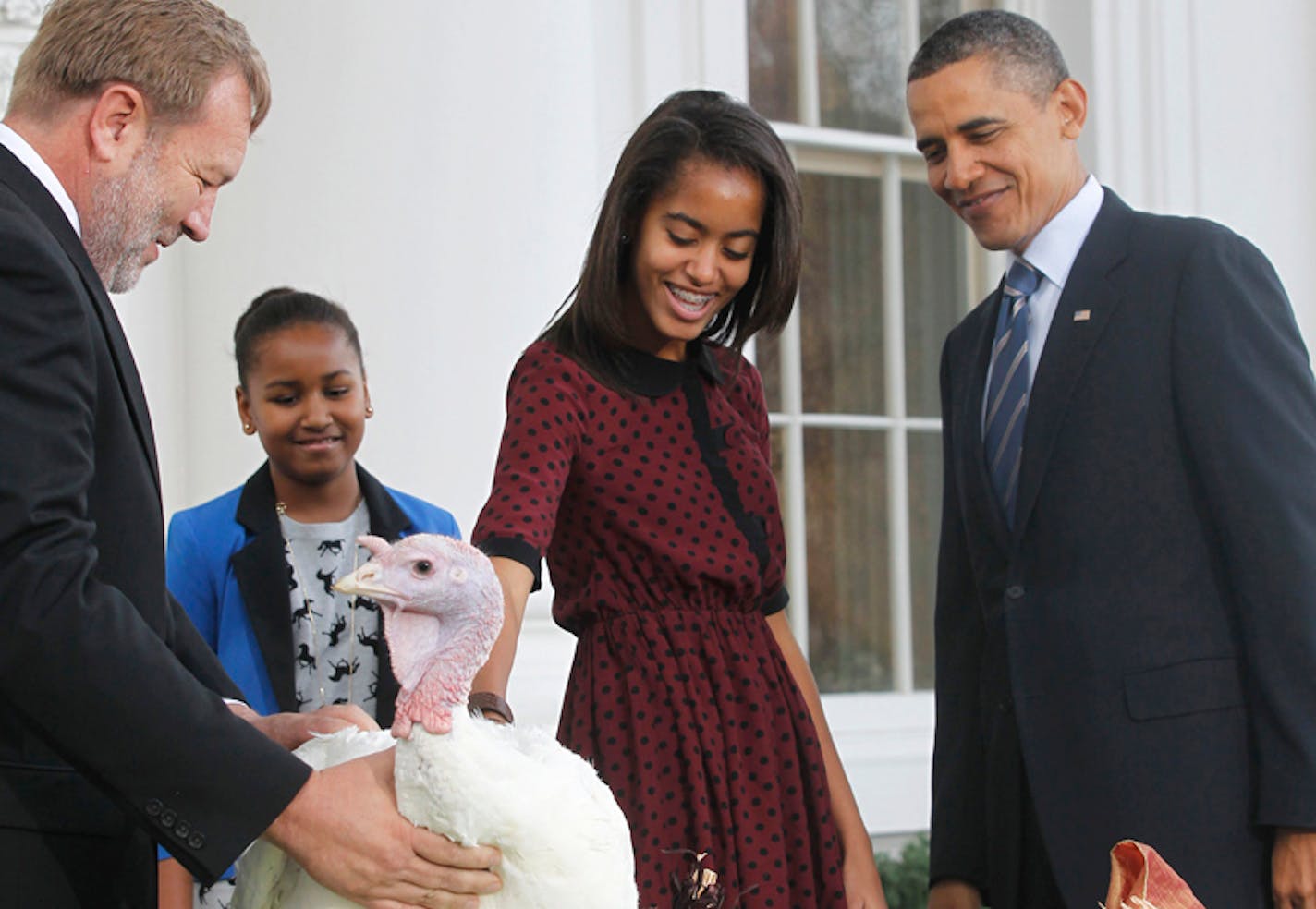 President Barack Obama, with daughters Sasha and Malia, pardons Liberty, a 19-week old, 45-pound turkey, on the occasion of Thanksgiving, Wednesday, Nov. 23, 2011.