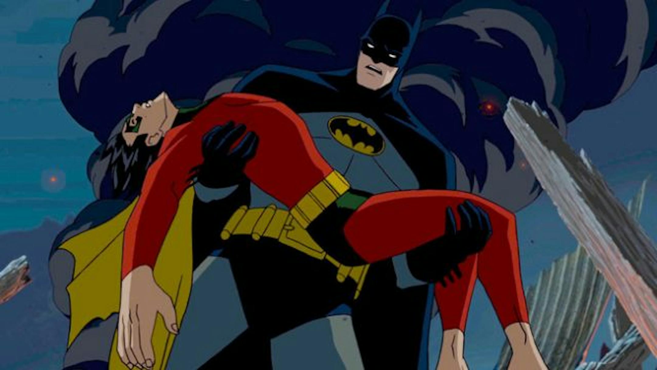 Batman holds a dead Robin in a scene from the animated movie "Batman: Under the Red Hood."