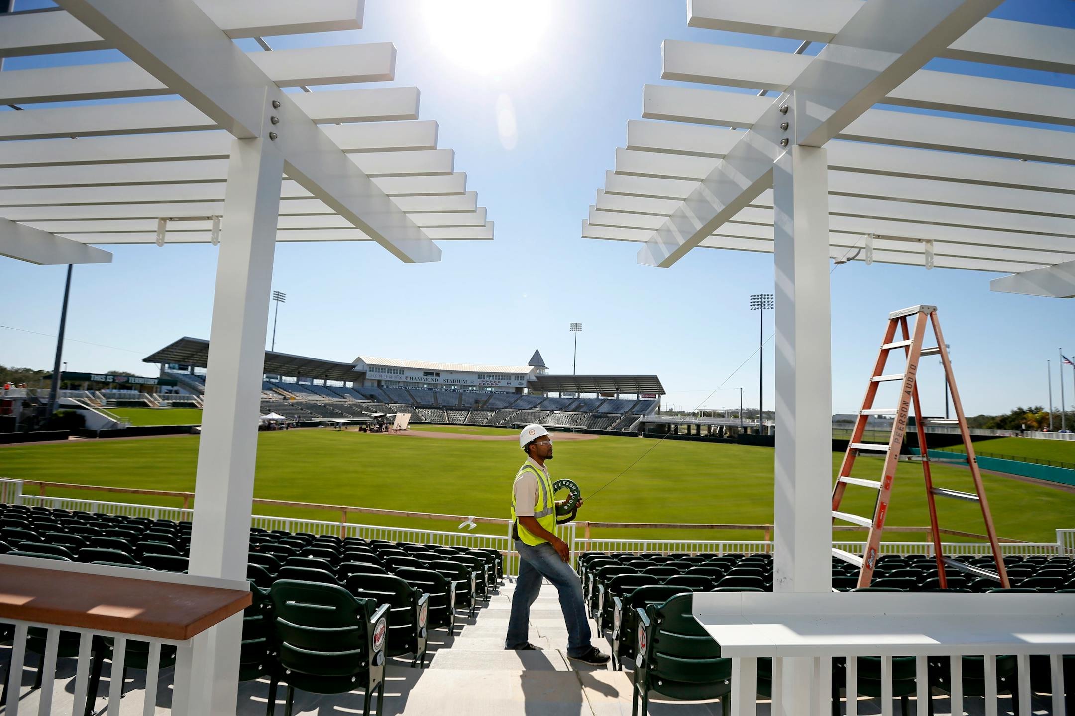 Worker Ronald St. Felix installed audio cables in the outfield as the renovation of Hammond Stadium continued Wednesday.