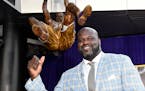 Shaquille O'Neal poses after the unveiling of a statue of him in front of Staples Center, Friday, March 24, 2017, in Los Angeles. (AP Photo/Mark J. Te