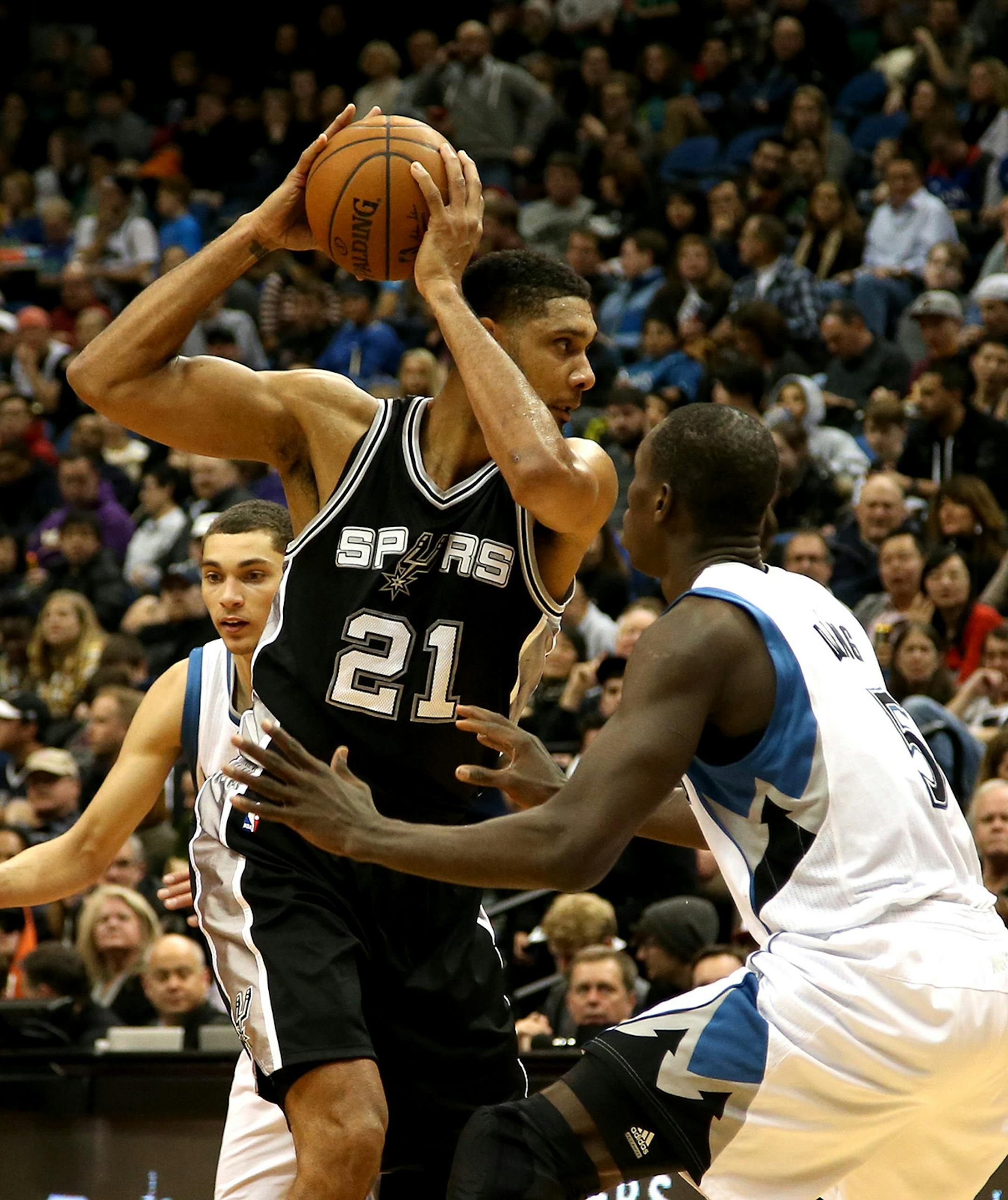 The Spurs Tim Ducan worked against Wolves Gorgui Dieng during the first half. ] (KYNDELL HARKNESS/STAR TRIBUNE) kyndell.harkness@startribune.com Timberwolves vs San Antonio at the Target Center in Minneapolis Min., Saturday, January 10, 2014.