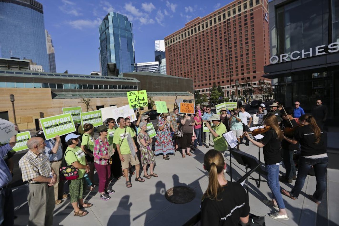 A crowd gathered in front of Orchestra Hall during a rally in support of Minnesota Orchestra musicians who have been locked out for nearly a year, in Minneapolis, Minn., on Friday, September 6, 2013.