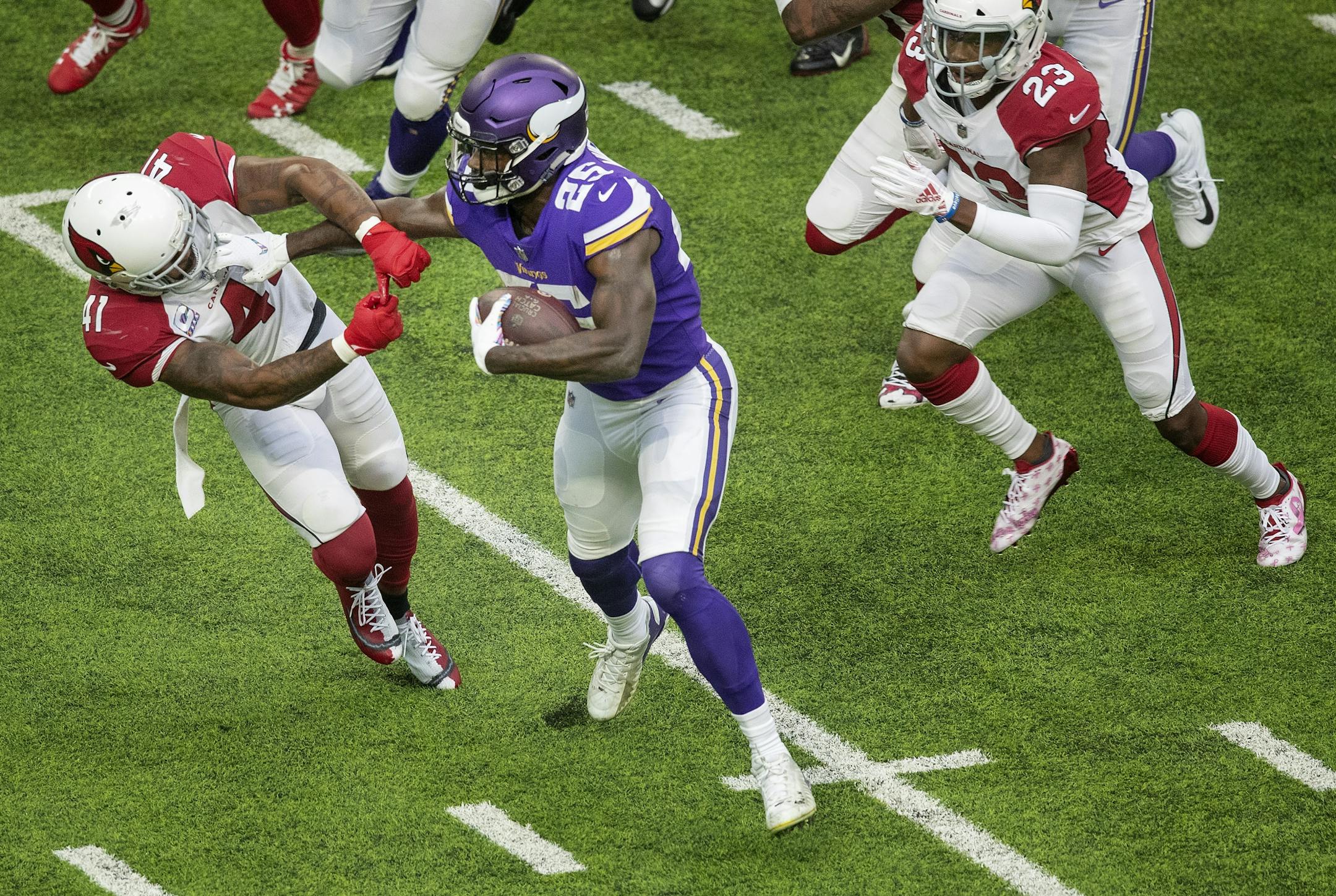 Minnesota Vikings running back Latavius Murray stuff armed Antoine Bethea (41) during 21-yard touchdown run in the first quarter.