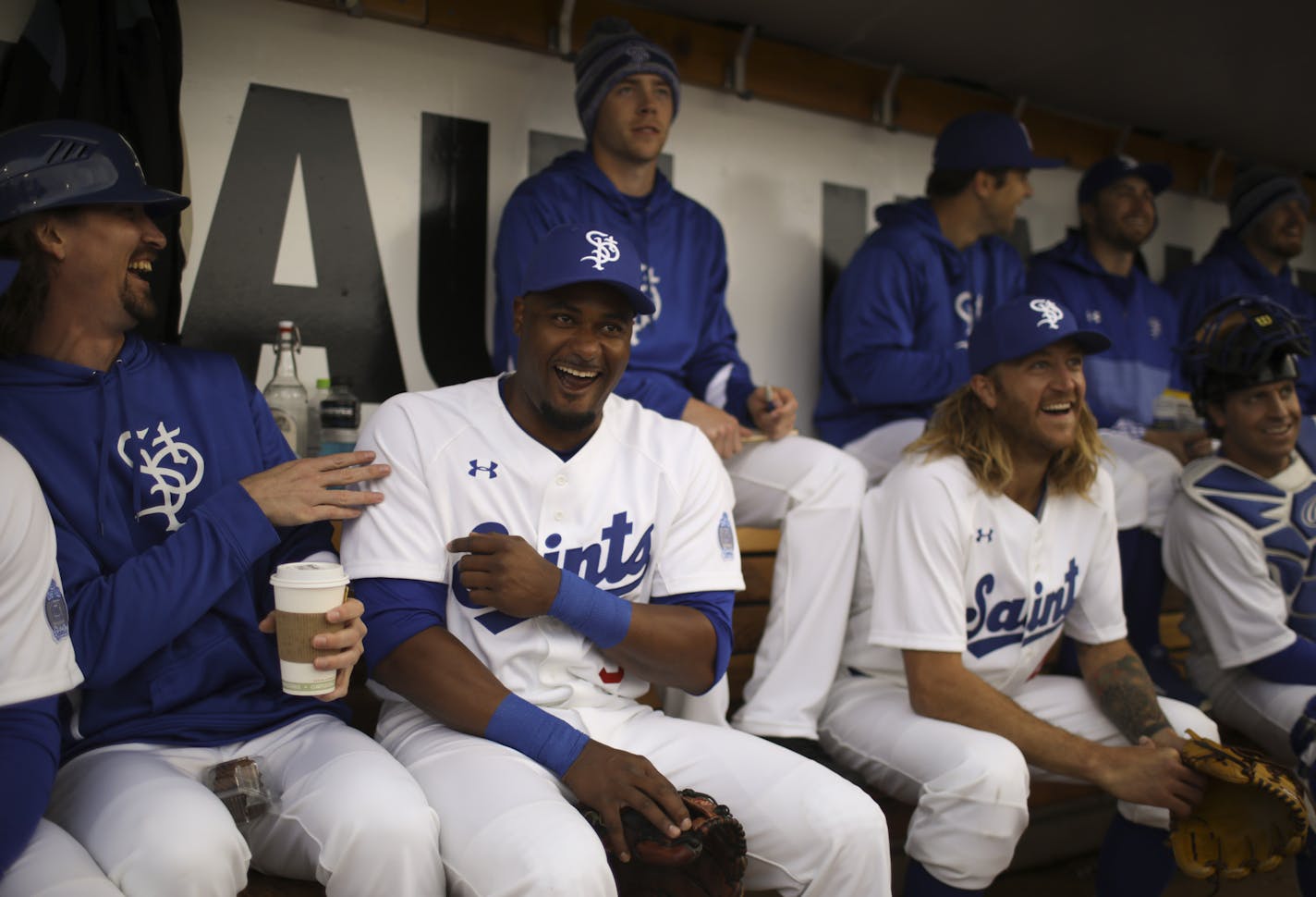 Saints players Robert Coe, tony Thomas, starting pitcher Mark Hamburger, and catcher Tony Caldwell, from left, cracked up as they watched a pre-game video projected on the scoreboard before they took the field. ] JEFF WHEELER &#xef; jeff.wheeler@startribune.com The St. Paul Saints held their 25th Anniversary Opening Day Thursday night, May 18, 2017 at CHS Field in St. Paul. The theme for the Silver Anniversary home opener, against the Gary SouthShore RailCats, was &#xec;We&#xed;re Gonna Make It