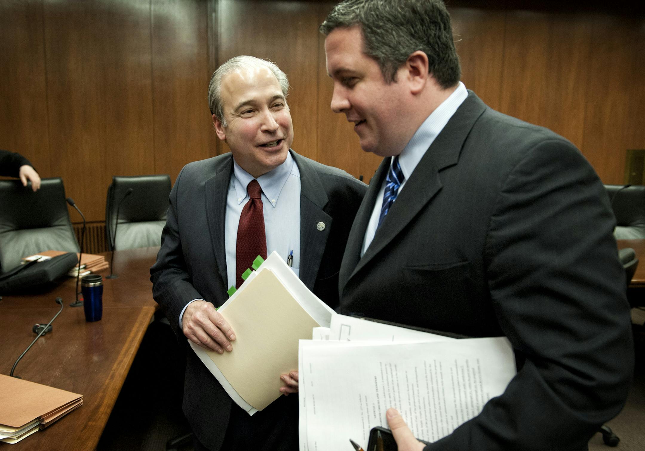 After the hearing Christopher Rager, right, of the NRA institute for legislative action talked with bill author Rep. Michael Paymar. Earlier Rager charged that Rep. Paymar was bullying DFL members of the committee who were wavering in support of his bill but were supporting a compromise bill without background checks. Supporters of universal background checks for guns faced a stiff test in House public safety committee Tuesday, March 19, 2013. The bill containing background checks may not have t