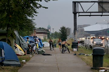 An American Indian encampment in south Minneapolis continues to grow and now includes several families with children. Some have come hoping to receive