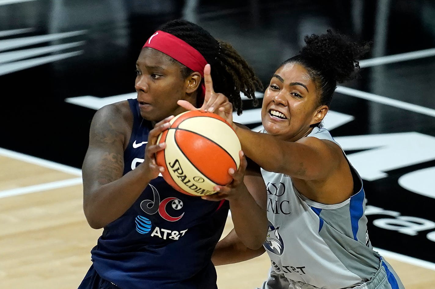 Lynx forward Damiris Dantas, right, tries to stop Washington Mystics forward Myisha Hines-Allen during the second half