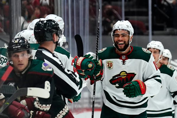 Wild left wing Jordan Greenway celebrates after scoring a goal against the Arizona Coyotes during the second period