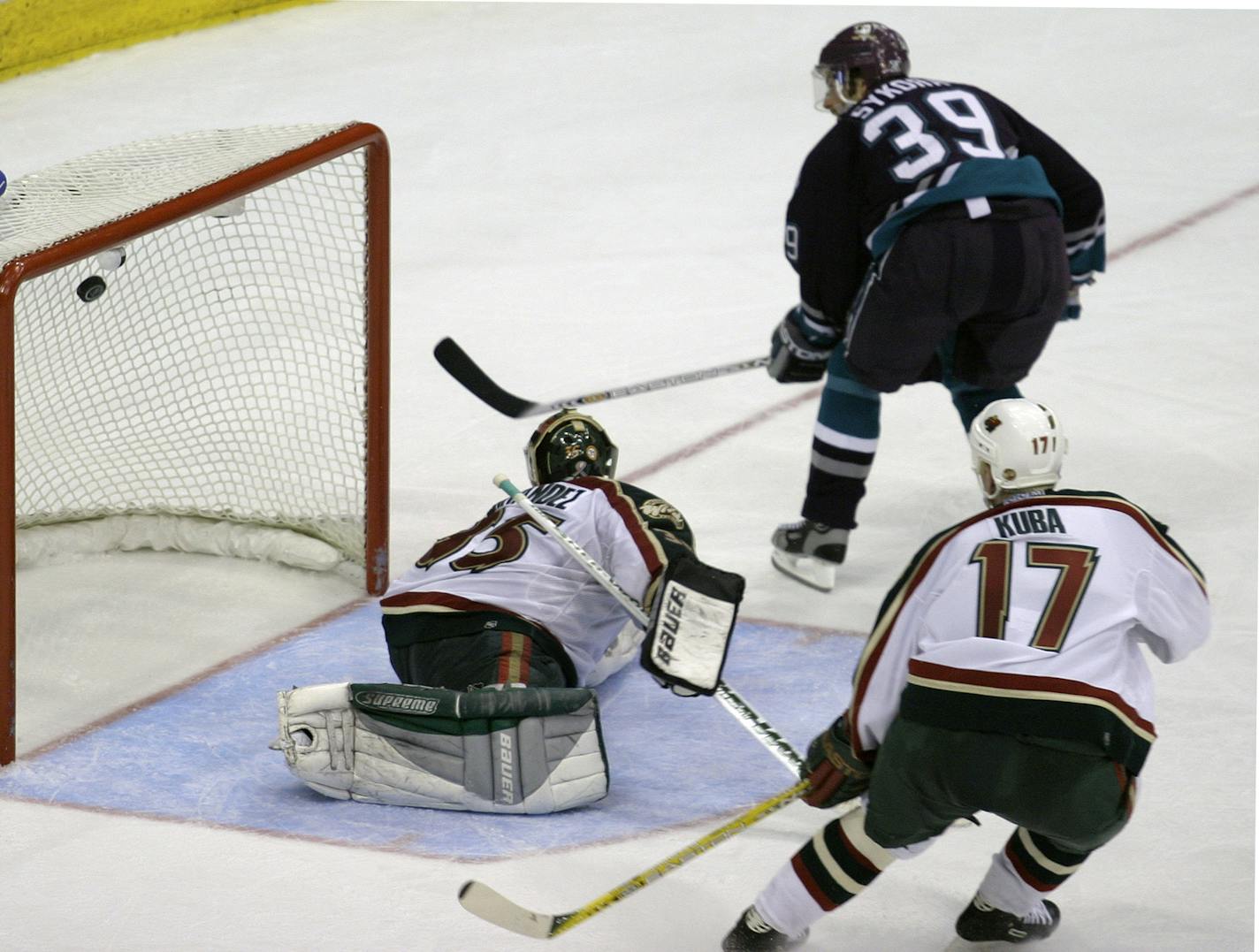 St. Paul, MN 5/10/2003 Minnesota Wild -vs- Anaheim Mighty Ducks Game 1 Anaheim's #39 Petr Sykora puts the puck past Minnesota Wild Goalie Manny Fernandez for the winning goal in the 2nd OT. Wild's Filip Kuba at right.