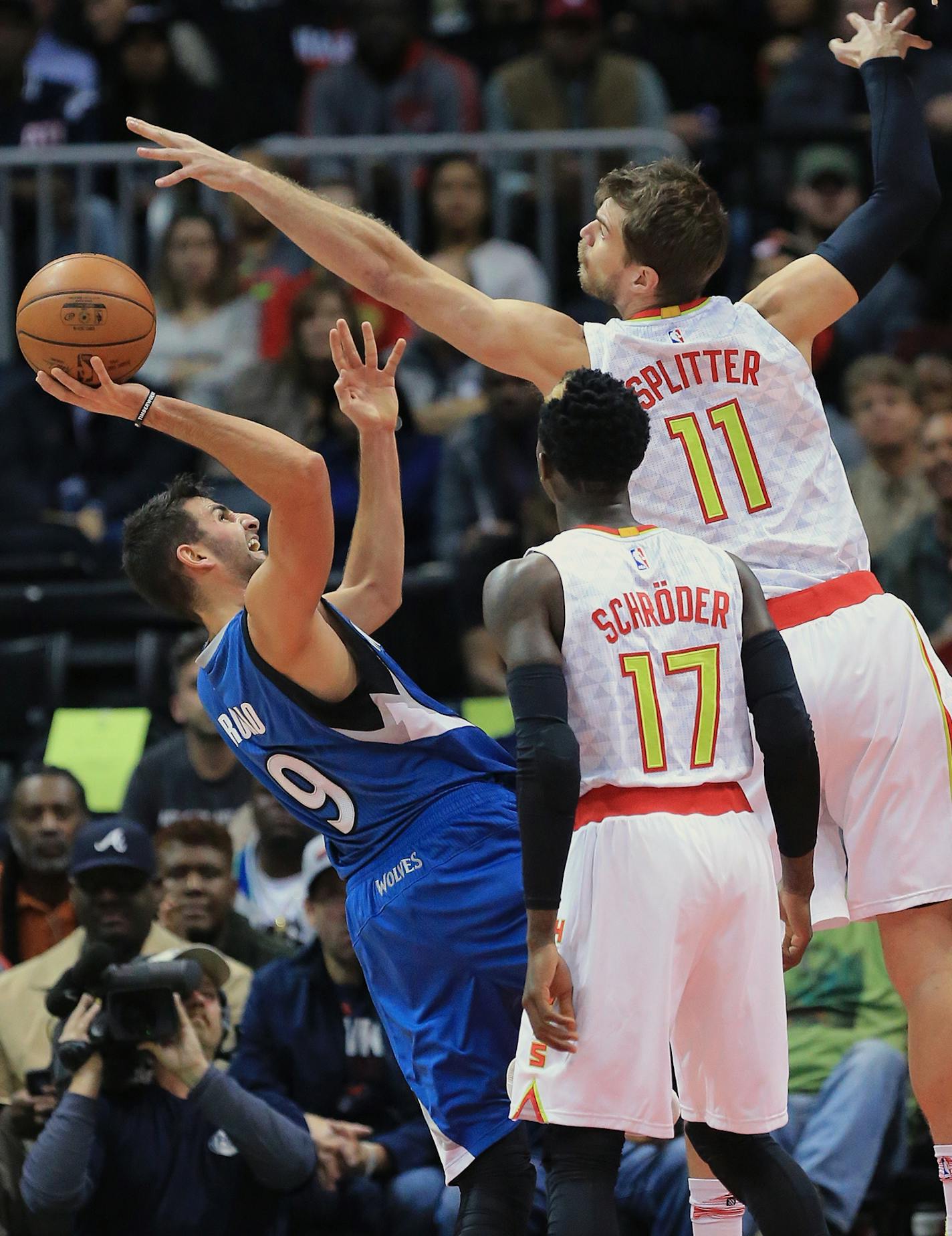 Atlanta Hawks Tiago Splitter defends as Minnesota Timberwolves Ricky Rubio shoots during the first half of an NBA basketball game Monday, Nov. 9, 2015, in Atlanta. (Curtis Compton/Atlanta Journal-Constitution via AP) MARIETTA DAILY OUT; GWINNETT DAILY POST OUT; LOCAL TELEVISION OUT; WXIA-TV OUT; WGCL-TV OUT; MANDATORY CREDIT