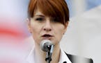 FILE - In this April 21, 2013 file photo, Maria Butina, leader of a pro-gun organization in Russia, speaks to a crowd during a rally in support of leg
