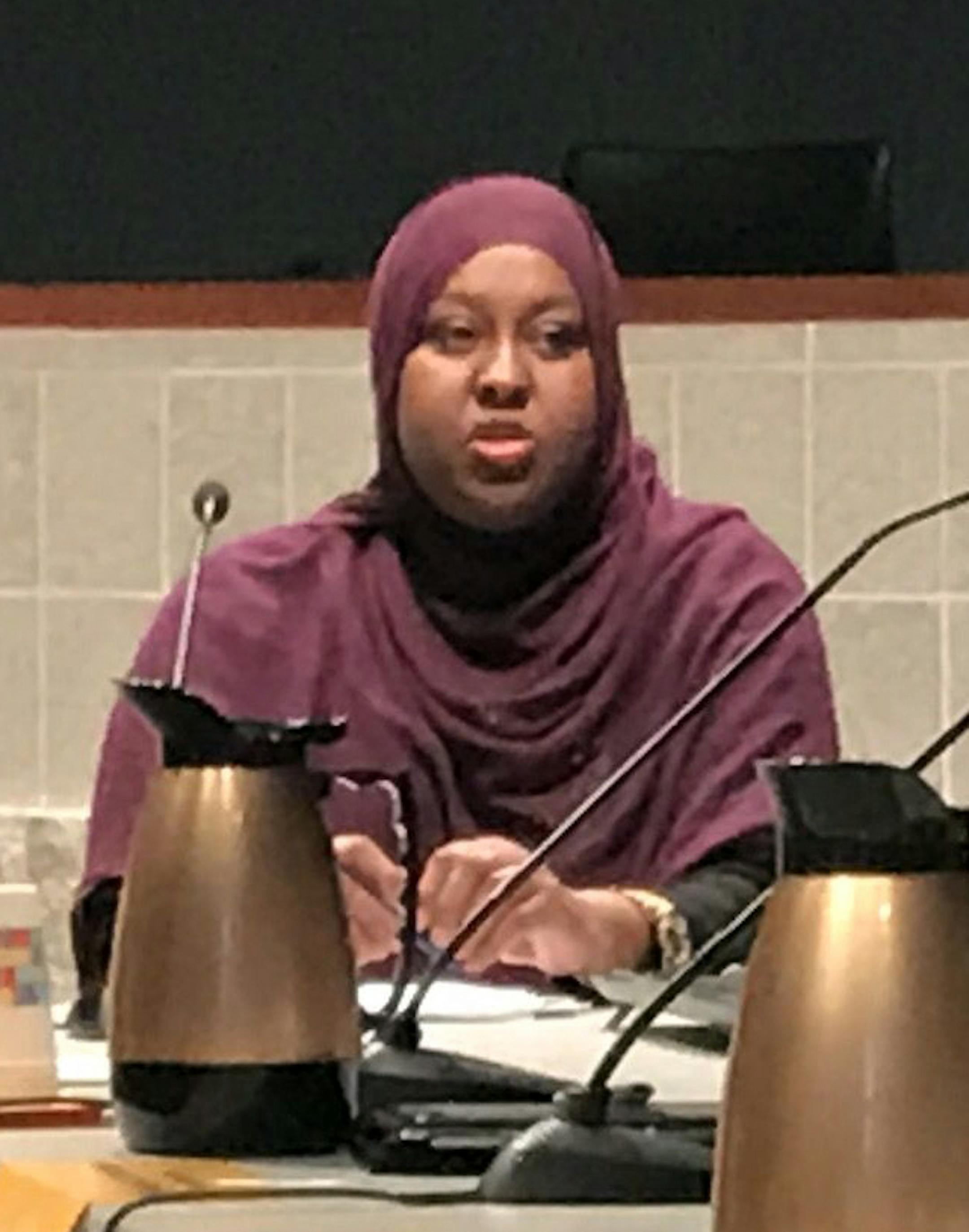 Hodan Hassan, left, addresses the Bloomington City Council and school board at Bloomington City Hall on Tuesday night. The administrations read a joint statement supporting the city's immigrant community.