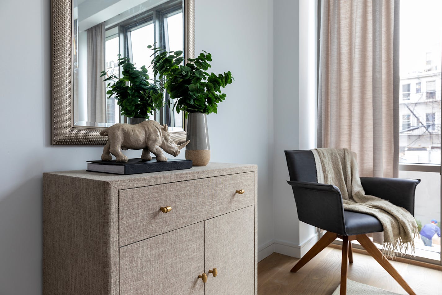 A fabric covered chest adds a sense of elegance to this bedroom space. (Handout/TNS)